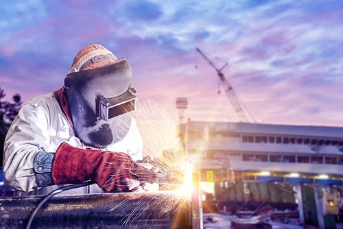 Welder Wearing Leather Welding Gloves